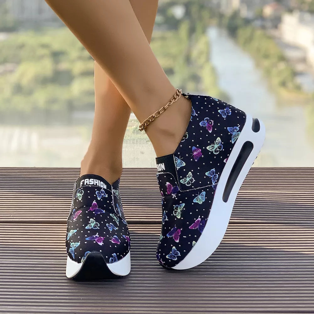 Butterfly print slip-on flats with air cushion and chunky sole.