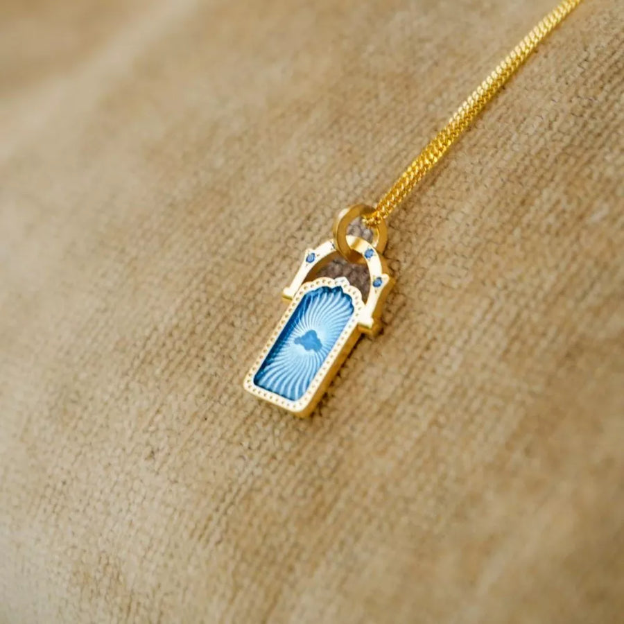 gold necklace with clasp and graphic