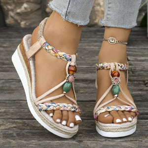Bohemian beaded espadrille wedges in beige with colorful braided straps and stacked heel.