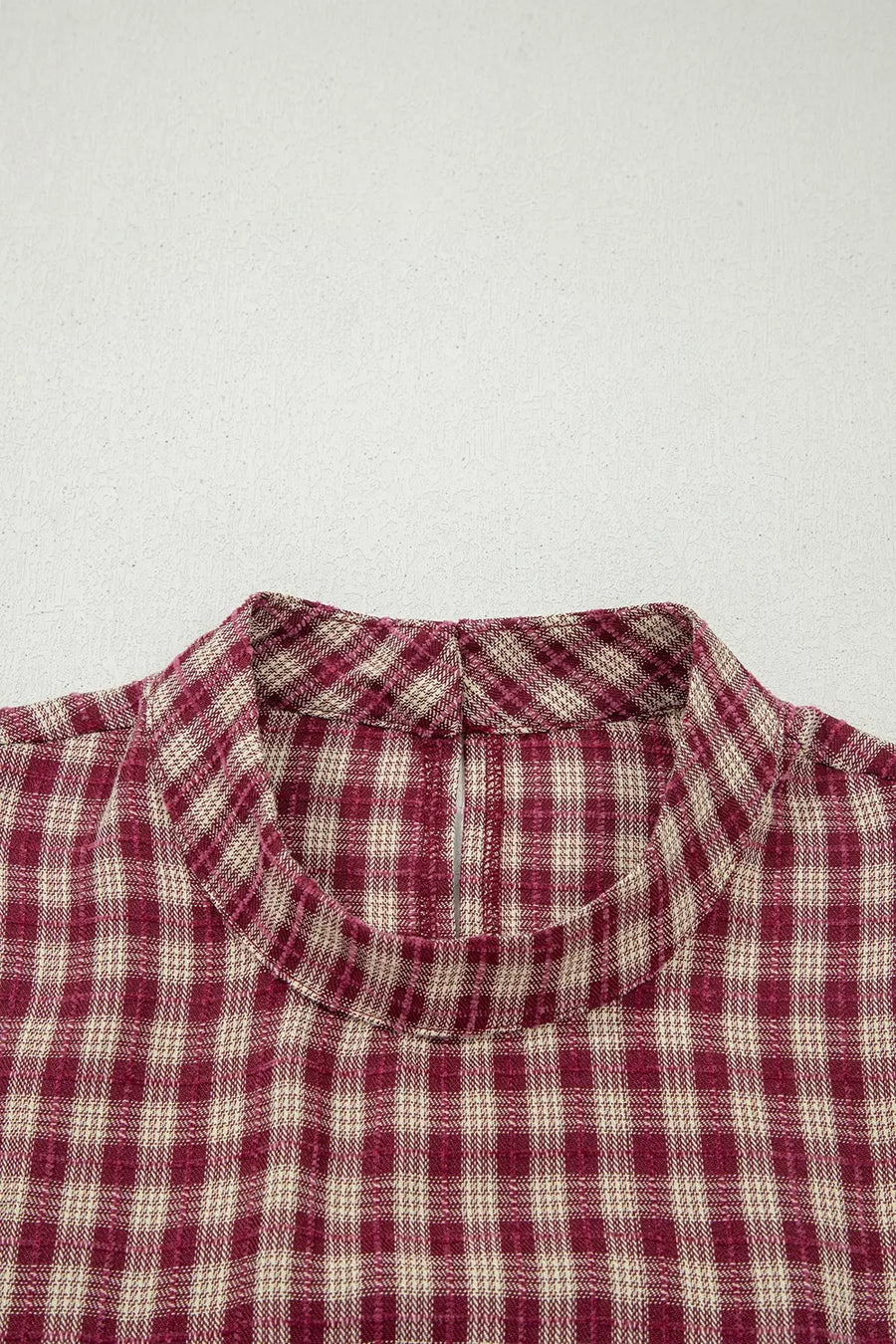 Country plaid long sleeve blouse in burgundy with button keyhole detail.