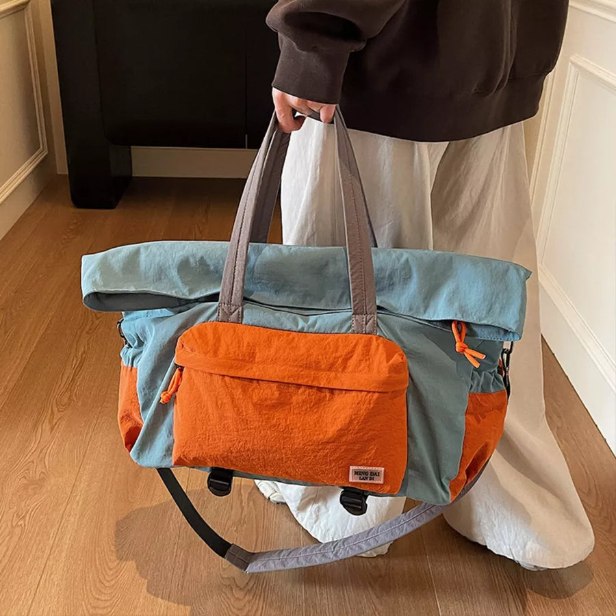 Tote bag in blue and orange nylon with front pocket and adjustable strap