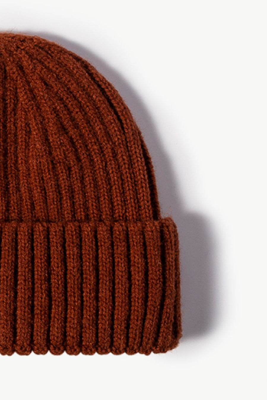Chunky ribbed knit beanie in brown acrylic with a cuffed hem.