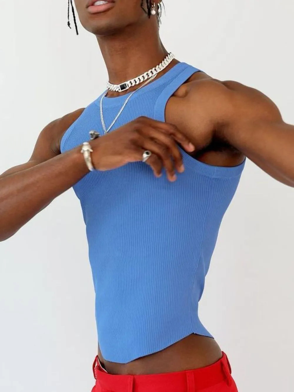 Blue ribbed tank top with asymmetric hem and scoop neck.