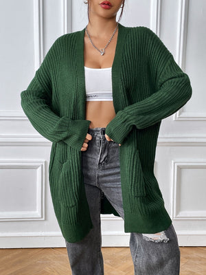 Green ribbed knit longline cardigan with pockets and open front.