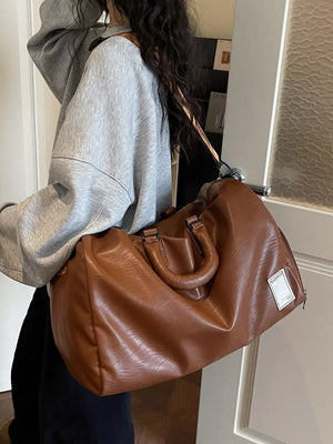 Brown pu leather travel bag with top handles and adjustable strap