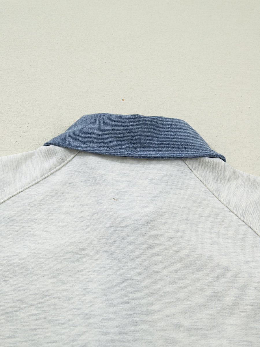 Light grey cotton polo top with blue denim collar detail.