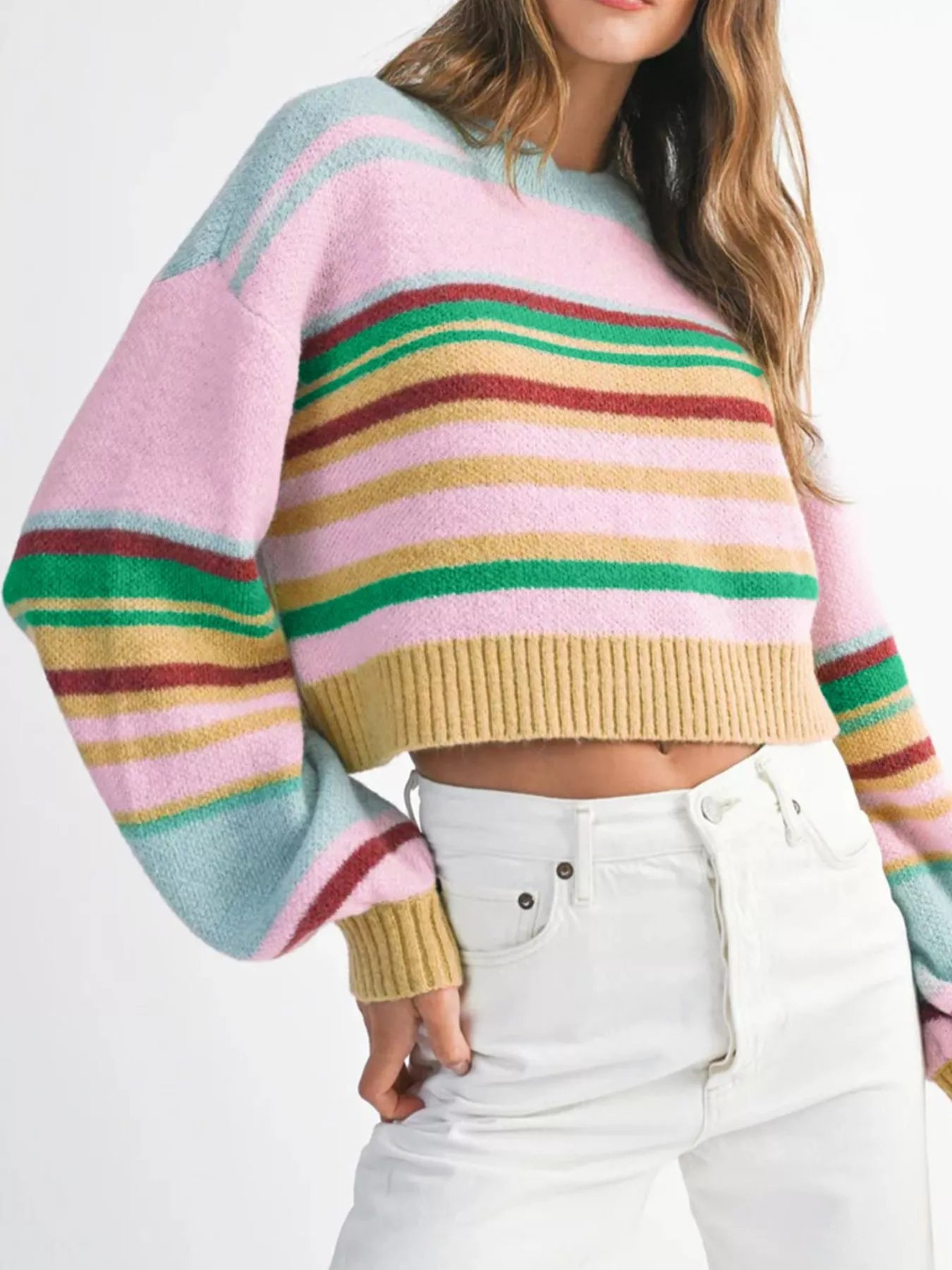 Multicolor striped cropped sweater with ribbed hem and cuffs.