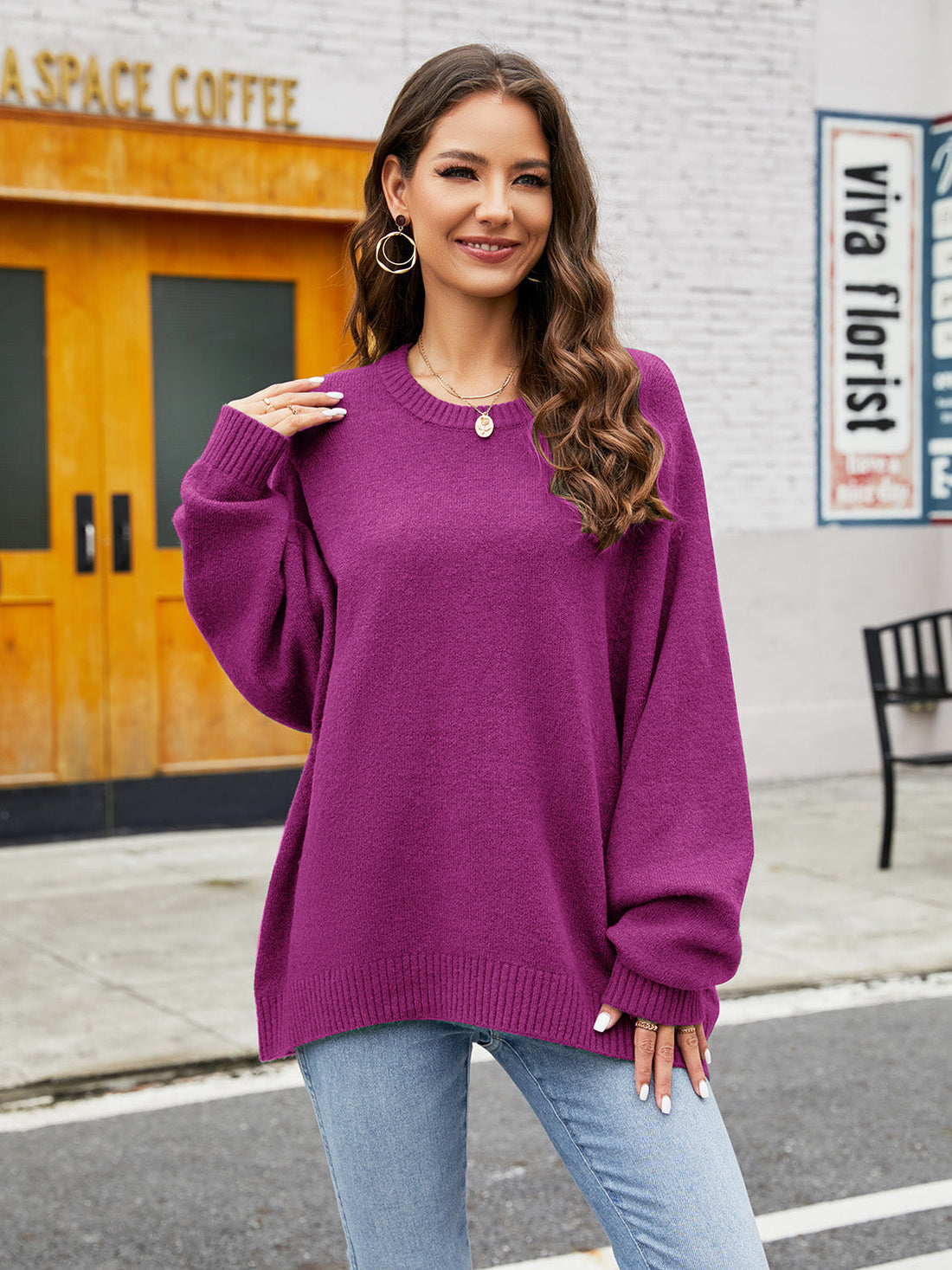 Fuchsia acrylic crewneck sweater with balloon sleeves and ribbed trim.