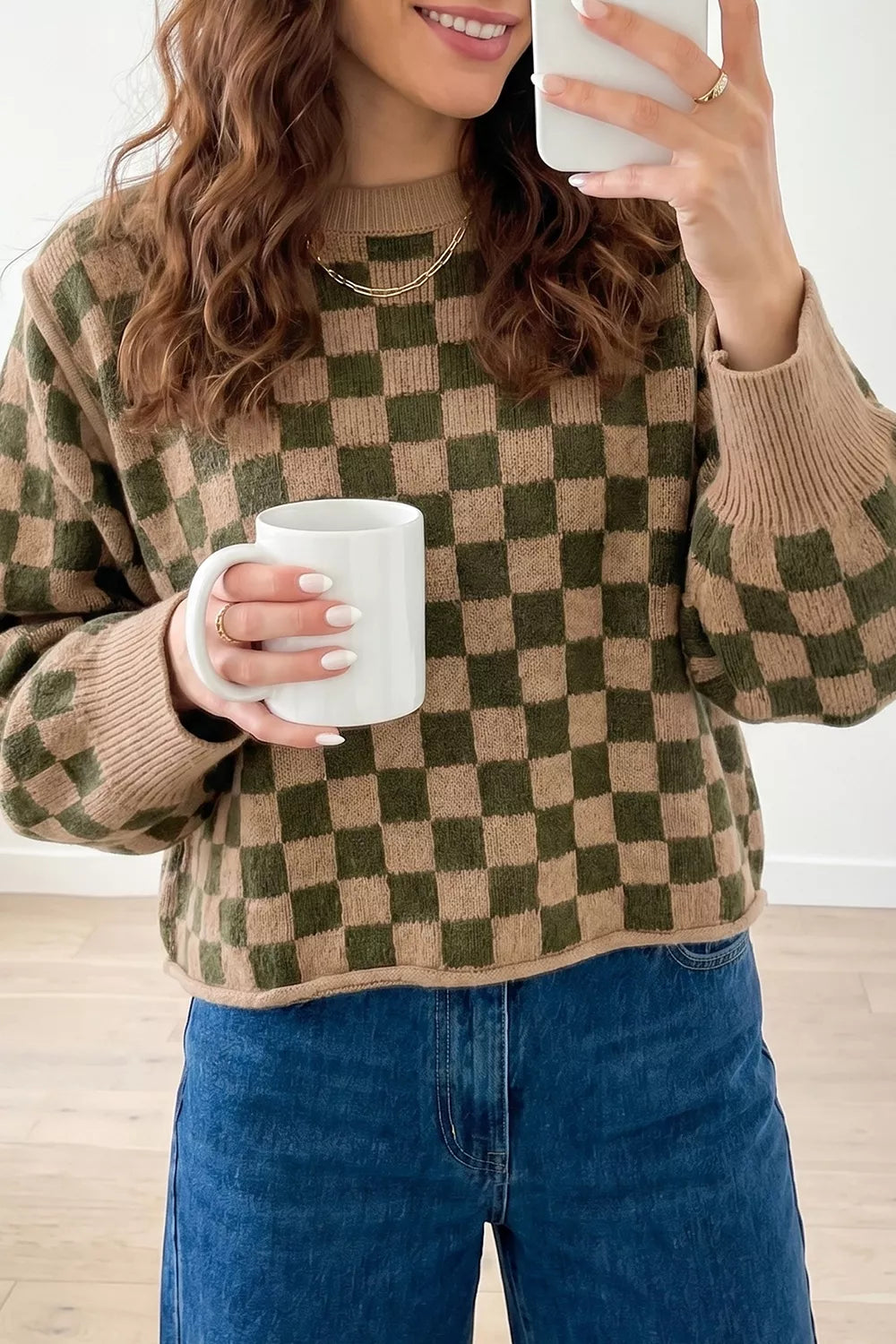 olive green pullover sweater with checkerboard and crew neck