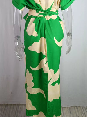 Belted shirt dress with abstract green and cream print, collared, button-down style.