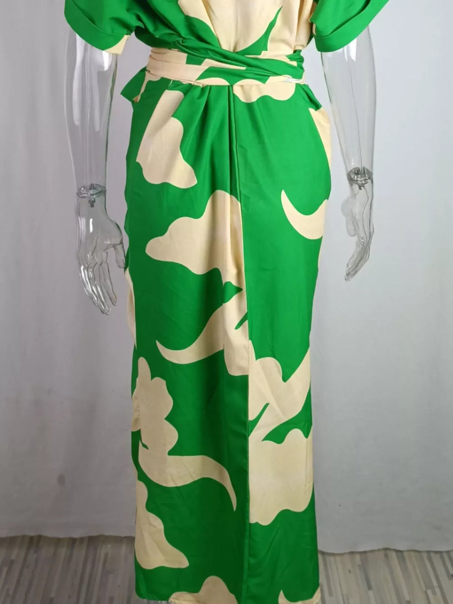 Belted shirt dress with abstract green and cream print, collared, button-down style.