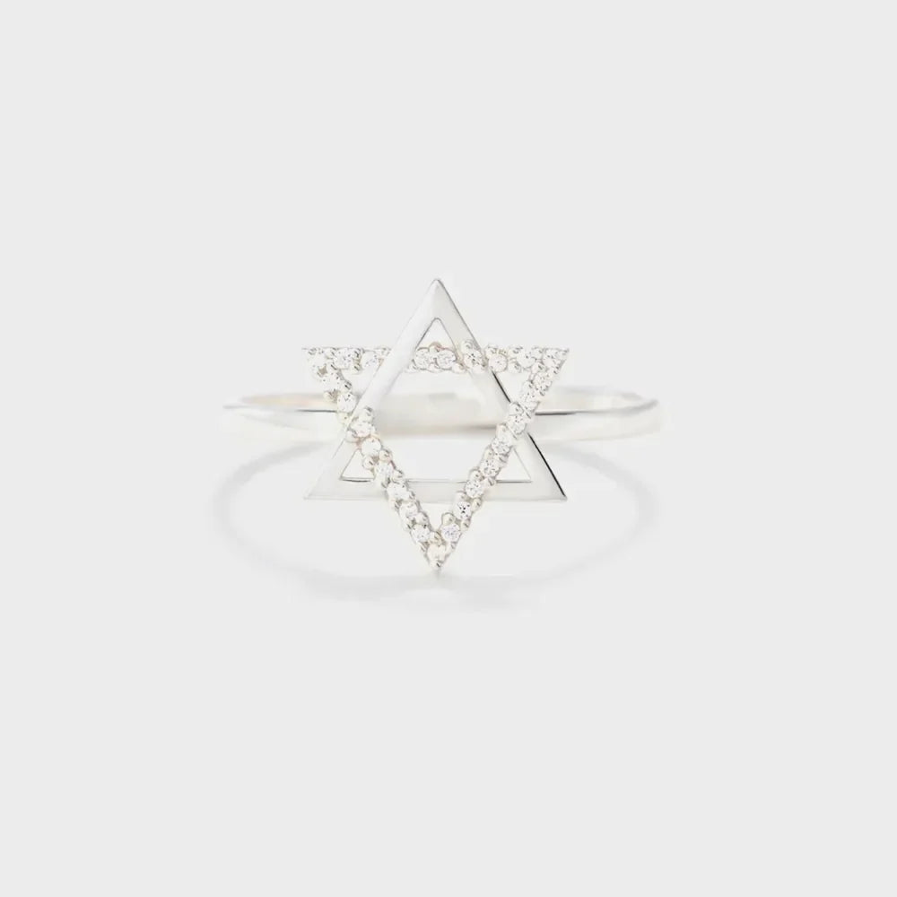 Star of David ring with white zirconia accents on a silver band.