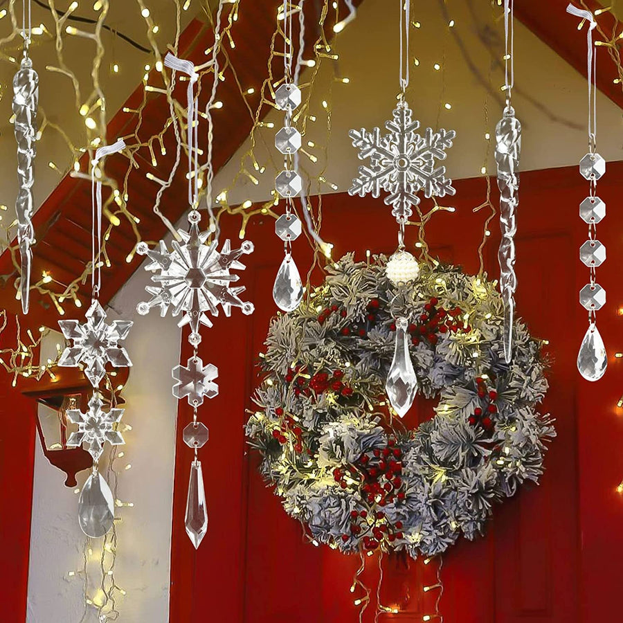 Transparent acrylic snowflake and icicle Christmas ornaments hang near a festive wreath.