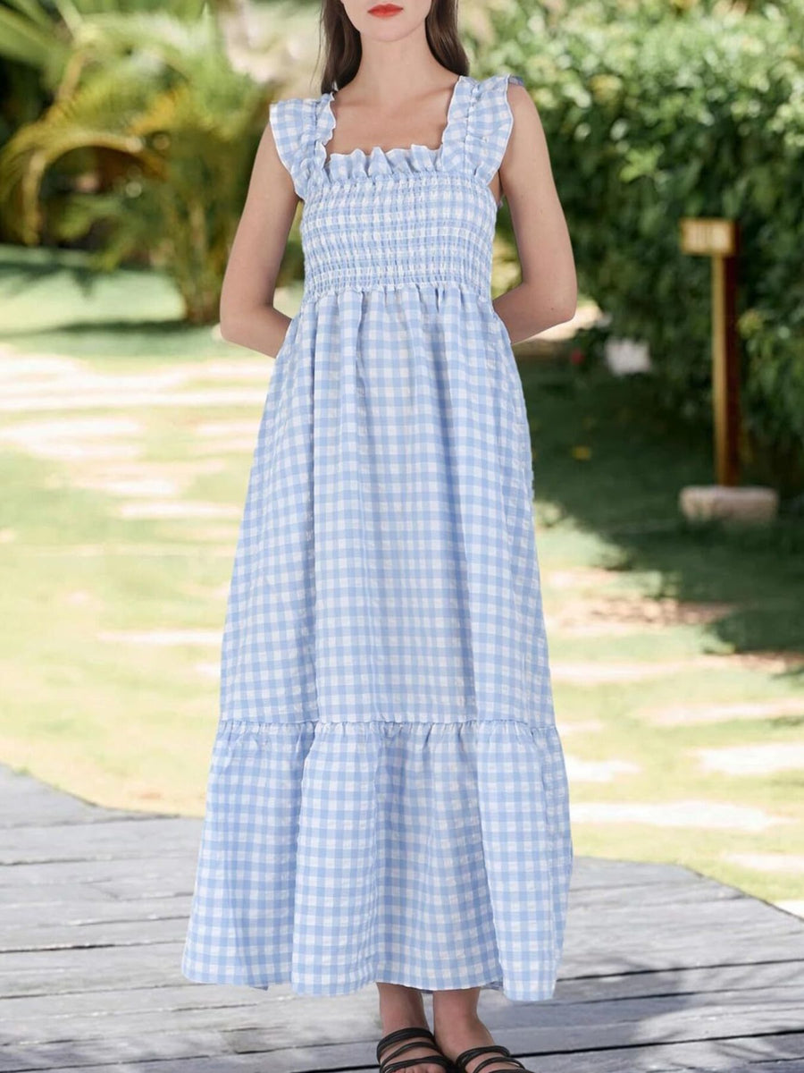 Blue gingham midi dress with smocked bodice and ruffled square neckline.