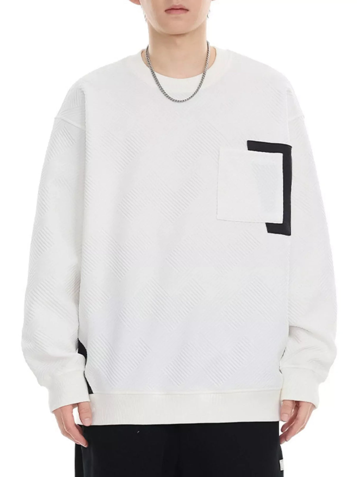 White crew neck sweatshirt with textured pattern and chest pocket detail