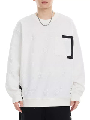 White crew neck sweatshirt with textured pattern and chest pocket detail