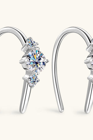 Silver ear climbers with three sparkling diamonds in a celestial design.