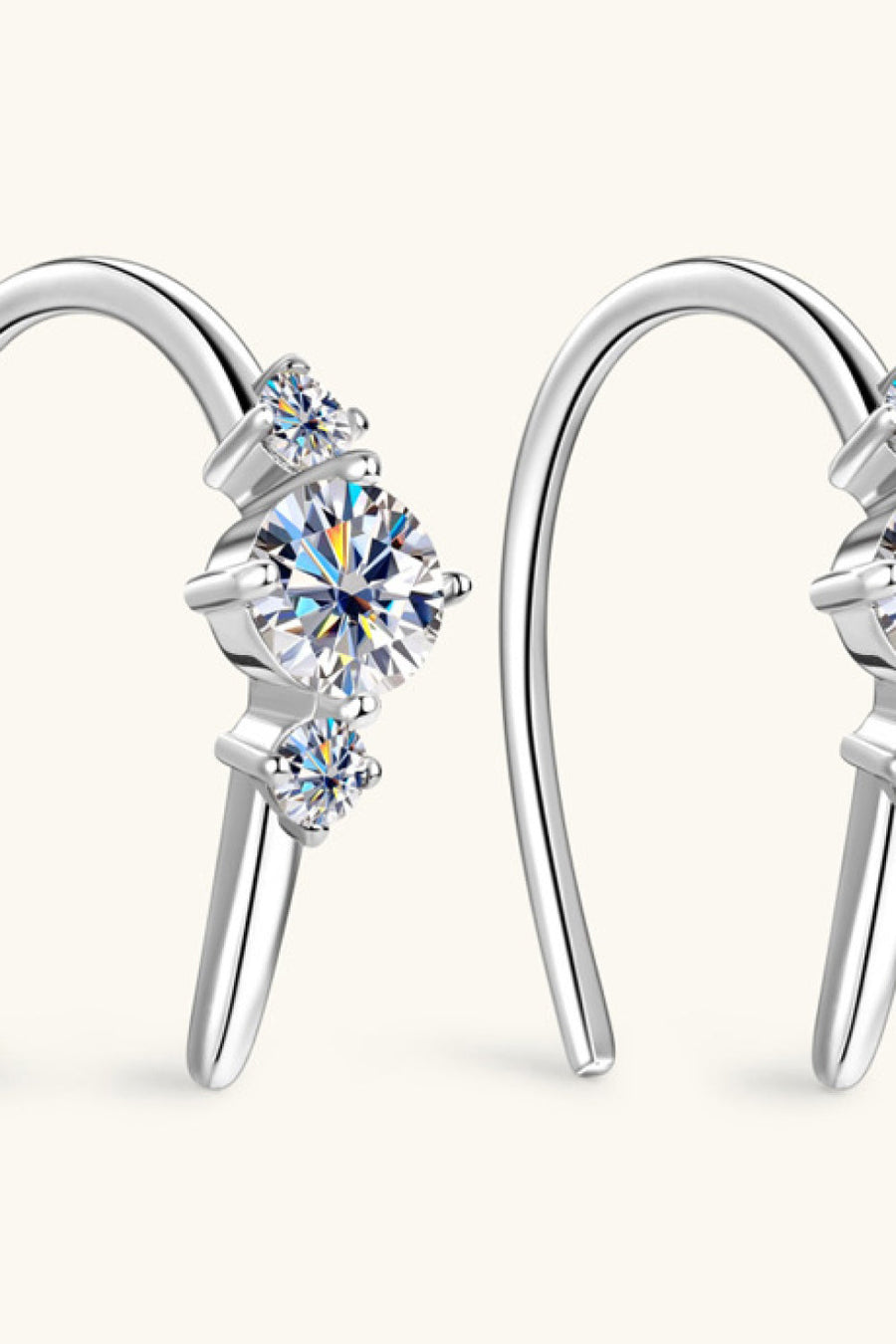Silver ear climbers with three sparkling diamonds in a celestial design.