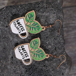 Coffee & Plants graphic drop earrings with green leaves, made of wood.