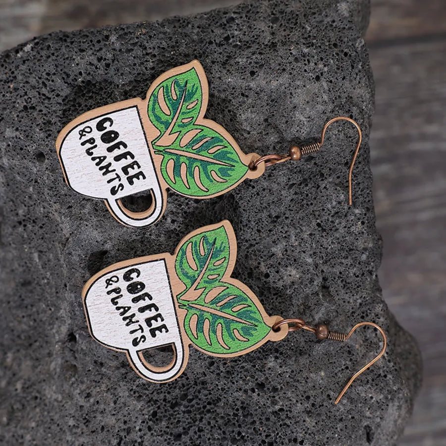 Coffee & Plants graphic drop earrings with green leaves, made of wood.