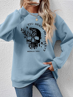 Air Force Blue raglan sweatshirt with floral skull graphic and text.