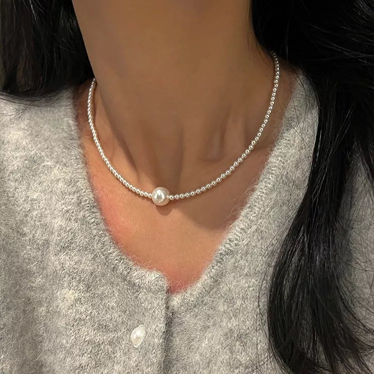 choker necklace in ivory featuring beaded and fitted fit