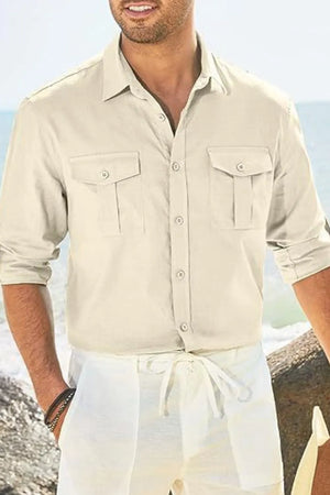 Beige linen utility shirt with two chest pockets, button front, and rolled sleeves.