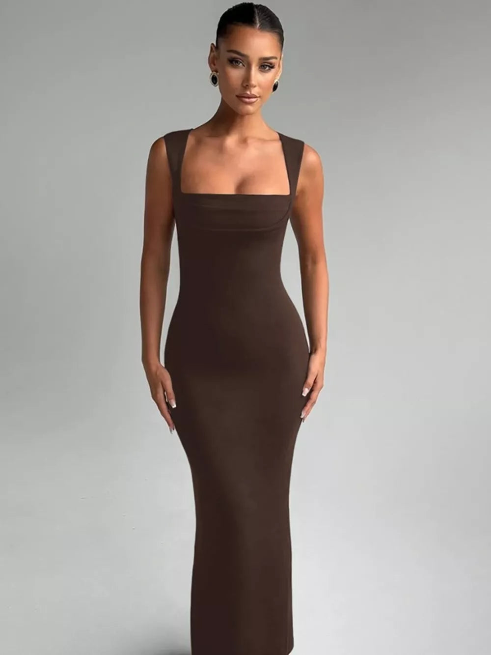 Brown bodycon maxi dress with square neckline and sleeveless cut.