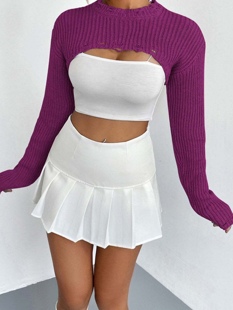Fuchsia distressed knit bolero crop top with ripped details and long sleeves.