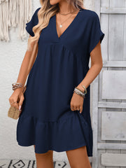 Navy blue V-neck mini dress with short sleeves and a ruffle hem.