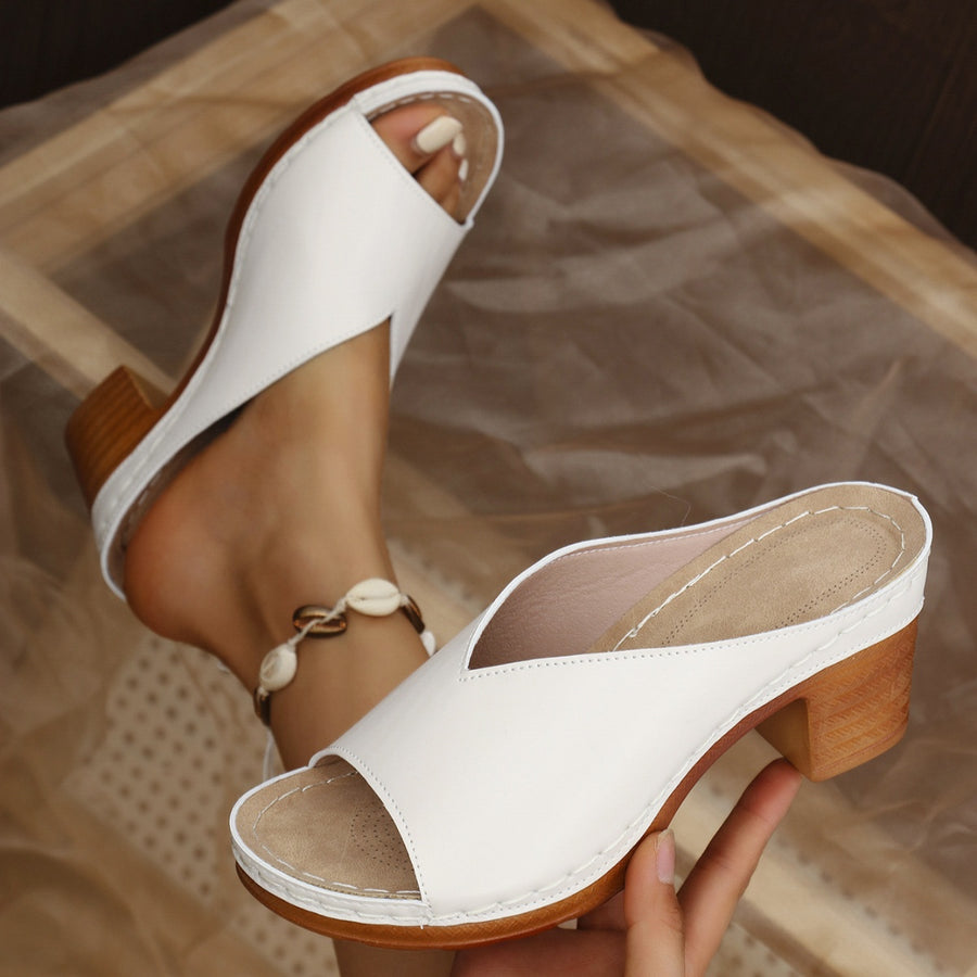 Off White open-toe block heel sandals with a V-shaped vamp and wooden heel.