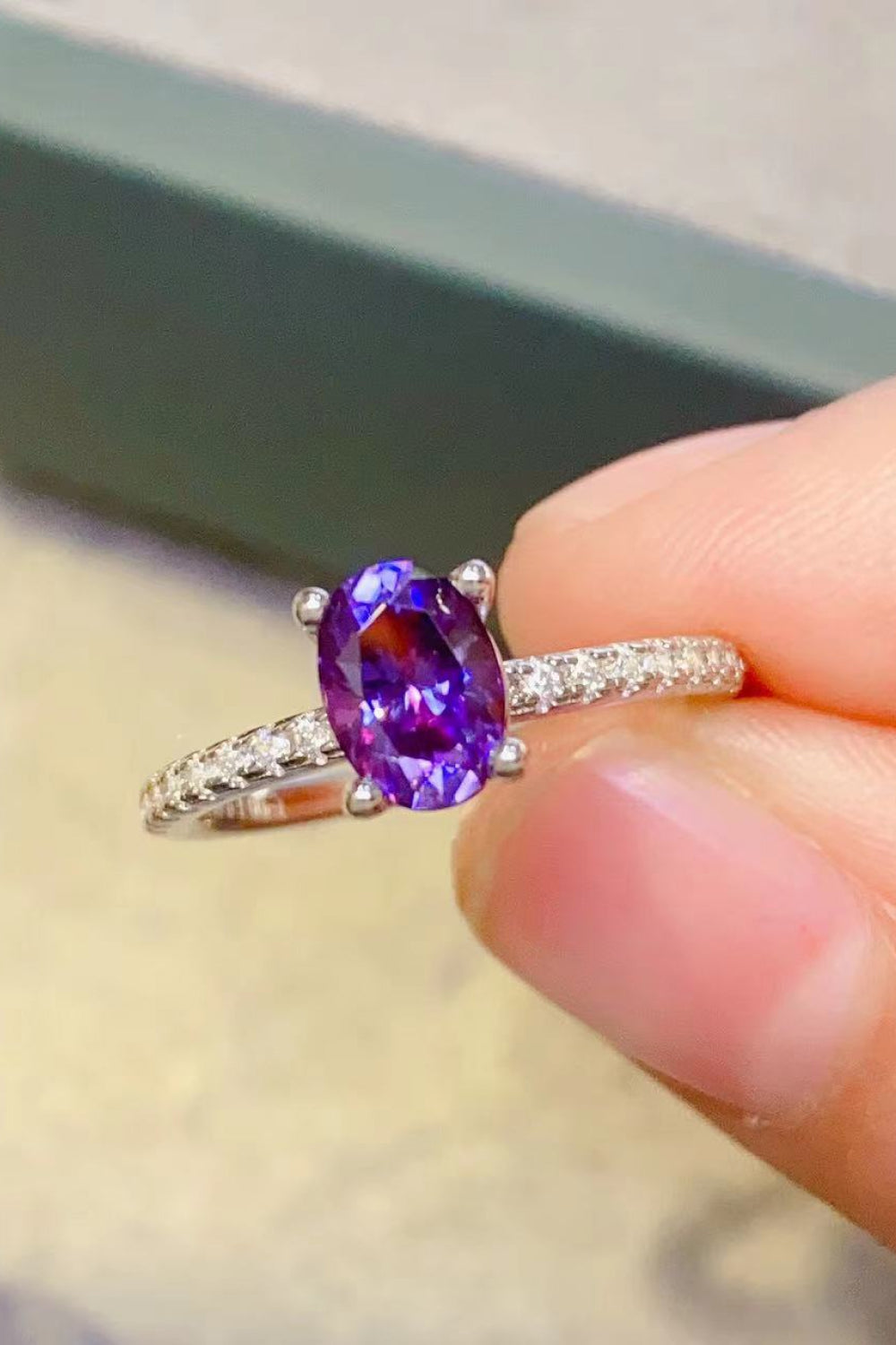 Amethyst oval pavé ring with diamond accents on a silver band.