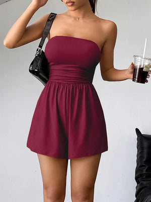 Burgundy strapless ruched waist romper with gathered shorts, cotton blend, casual style.