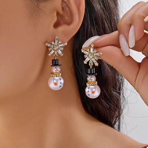 earrings in gold featuring rhinestone embellishment and dangling fit