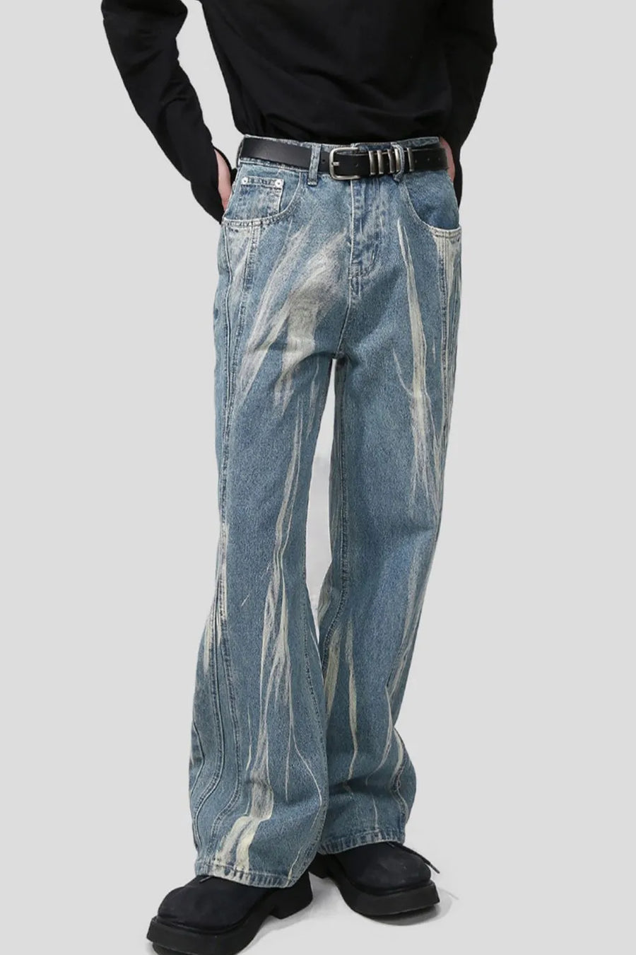 Bleached wash wide leg denim jeans with a distressed pattern.