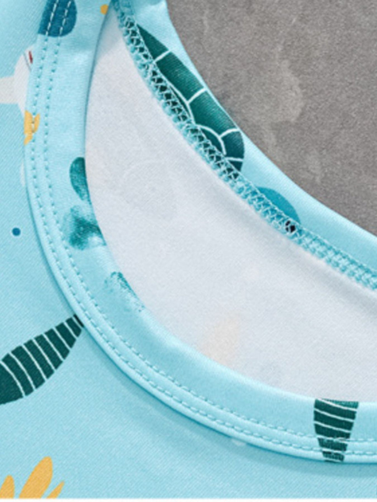 Toddler tee with sea creature print, round neckline, and contrast stitching.