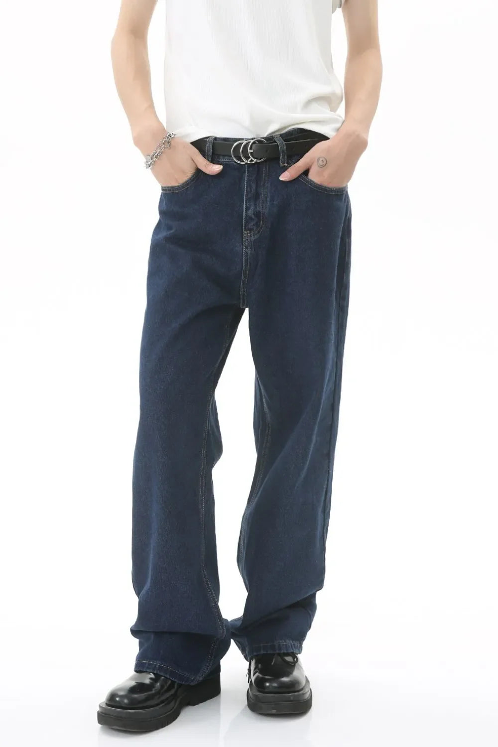 Baggy dark wash denim jeans with a subtle flare and casual styling.