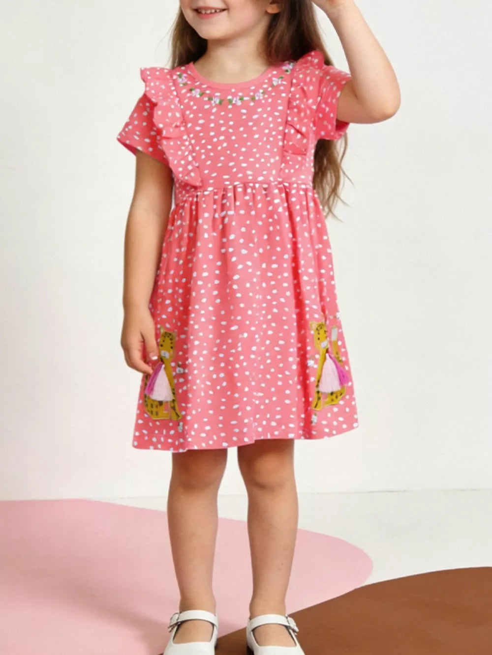 Coral polka dot cotton dress with ruffled sleeves, floral embroidery, and animal appliques.