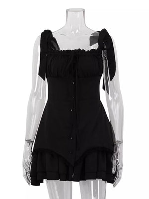 Black mini dress with tie straps, square neckline, ruffled trim, and button front.