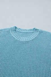 Relaxed ribbed knit sweater top in light blue with crew neck and textured cotton fabric.
