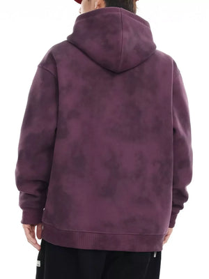 Oversized tie-dye hoodie in Berry Purple with a drawstring hood and ribbed cuffs.