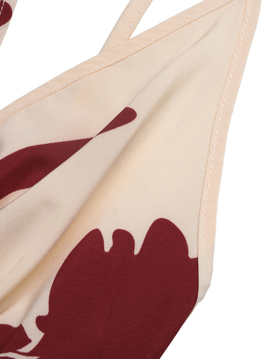 Floral maxi dress with deep V-neck in cream with burgundy abstract floral print.