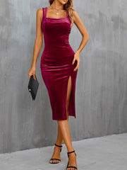 Burgundy velvet midi dress with a square neckline and high slit.