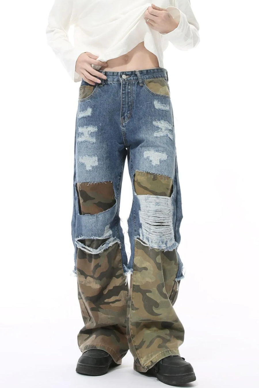 Camouflage panel distressed wide-leg jeans in blue denim with ripped details.