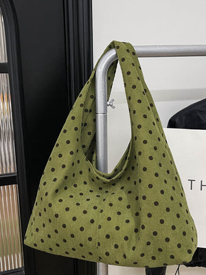 olive green handbag featuring polka-dot print and polka dot