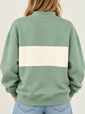 Light Blue sweatshirt featuring buttoned and color-block, abstract-print