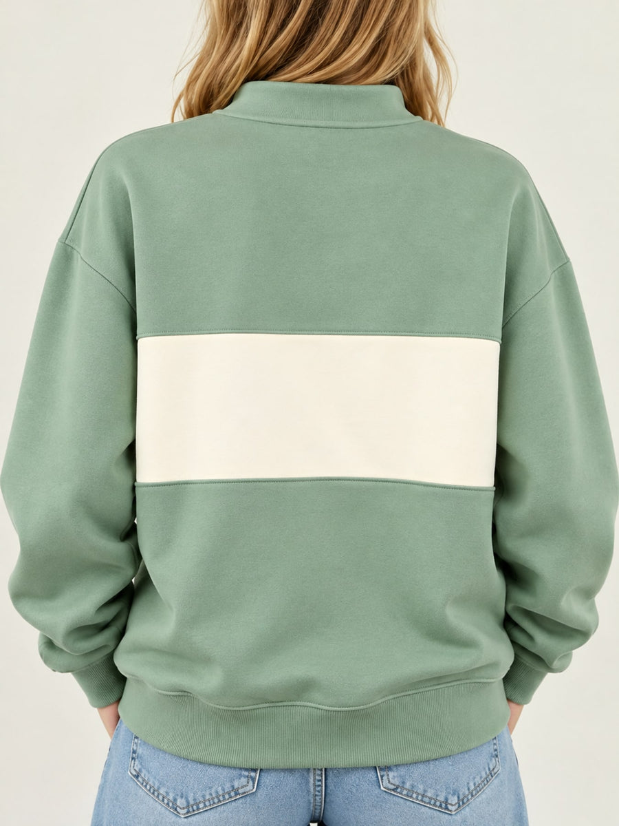 Light Blue sweatshirt featuring buttoned and color-block, abstract-print