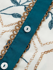 Cotton polo collar mini dress with chain and leaf print, button front, and decorative trim.