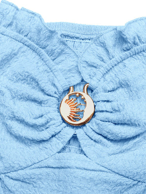 Smocked blue tube top with a gold sun and moon buckle detail.
