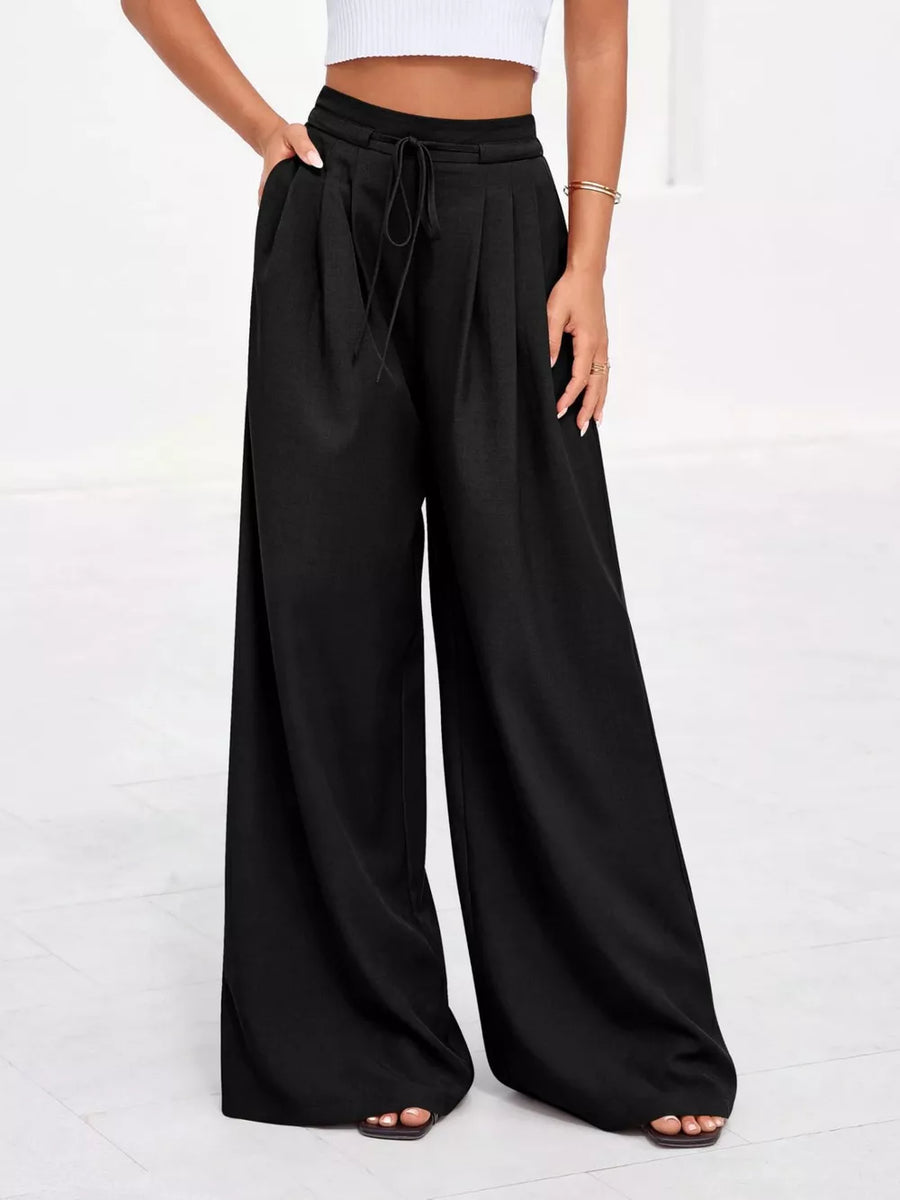 Black high-waisted pleated wide-leg pants with drawstring and pockets